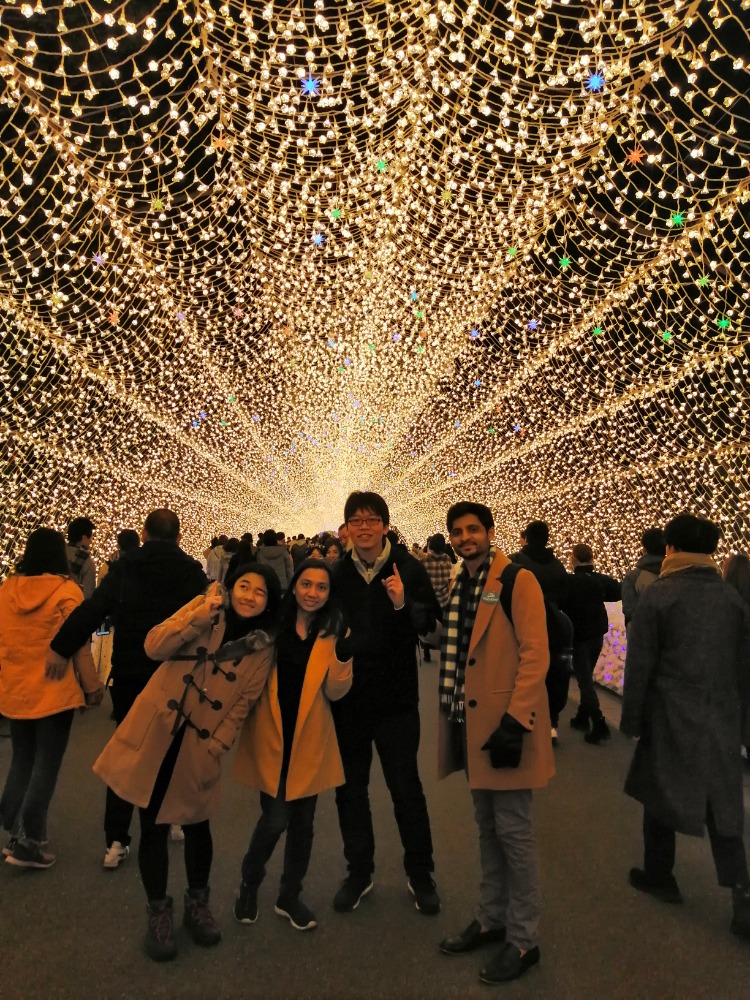 Walking under tunnel of lights